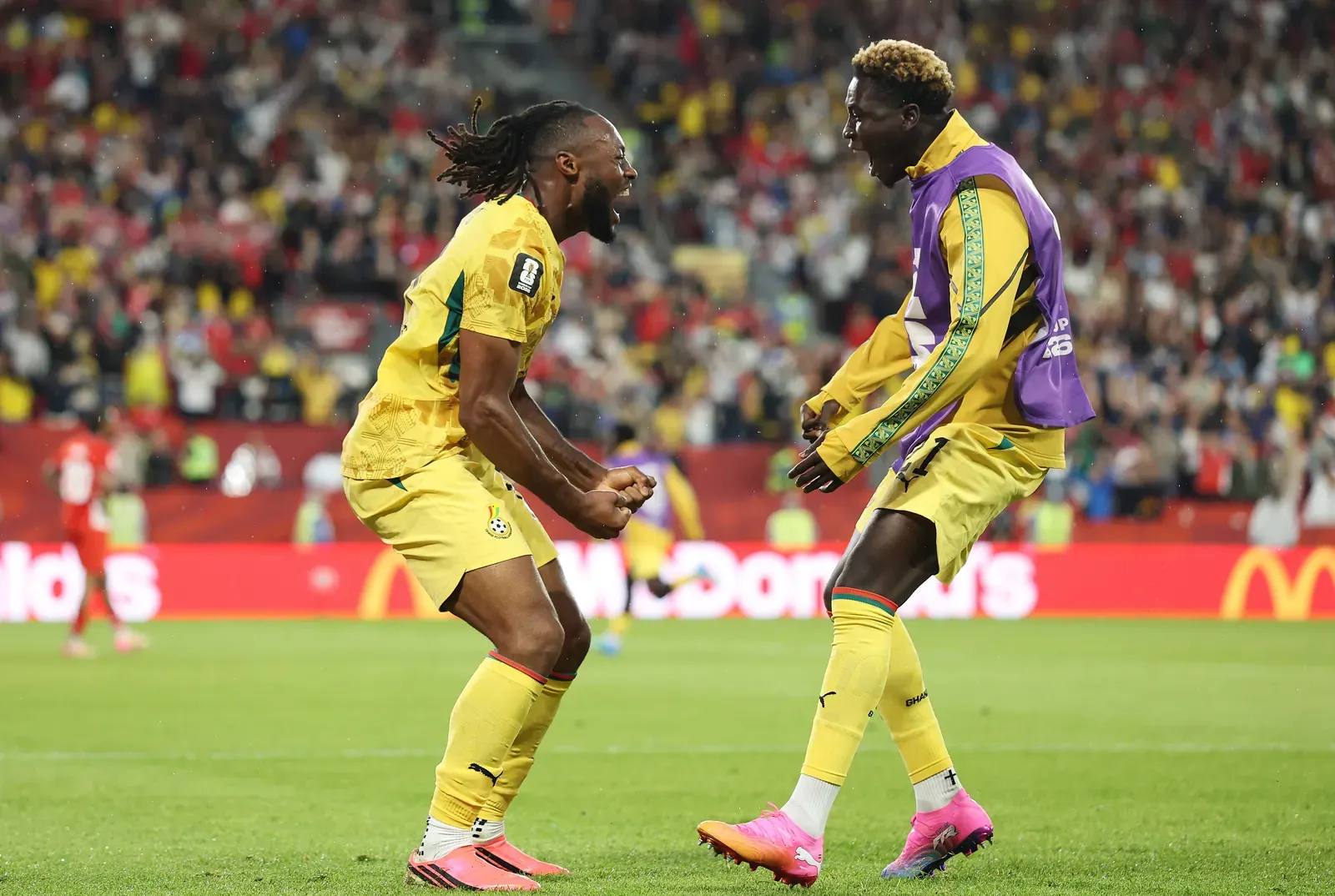 Ghana players celebrating a goal against Panama in a FIFA World Cup match.