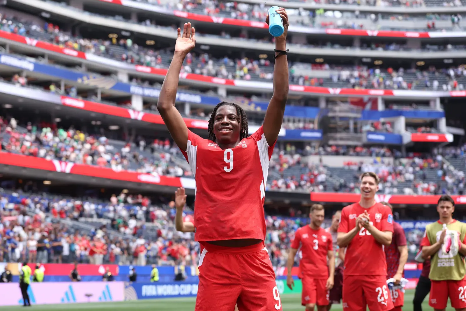 Johan Manzambi celebrating a goal during a FIFA World Cup 2026 match.