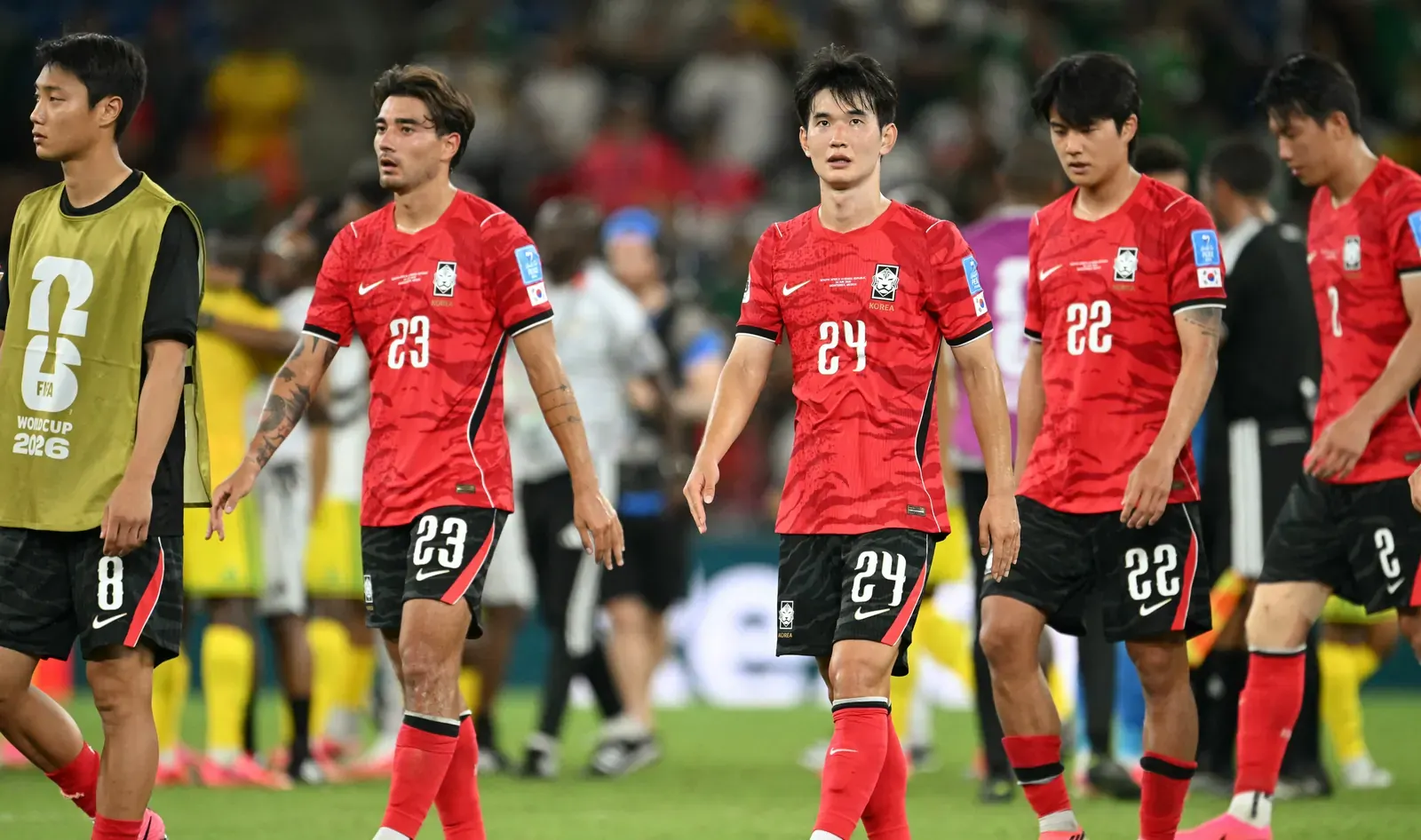 Korea Republic national football team players in action during a match.