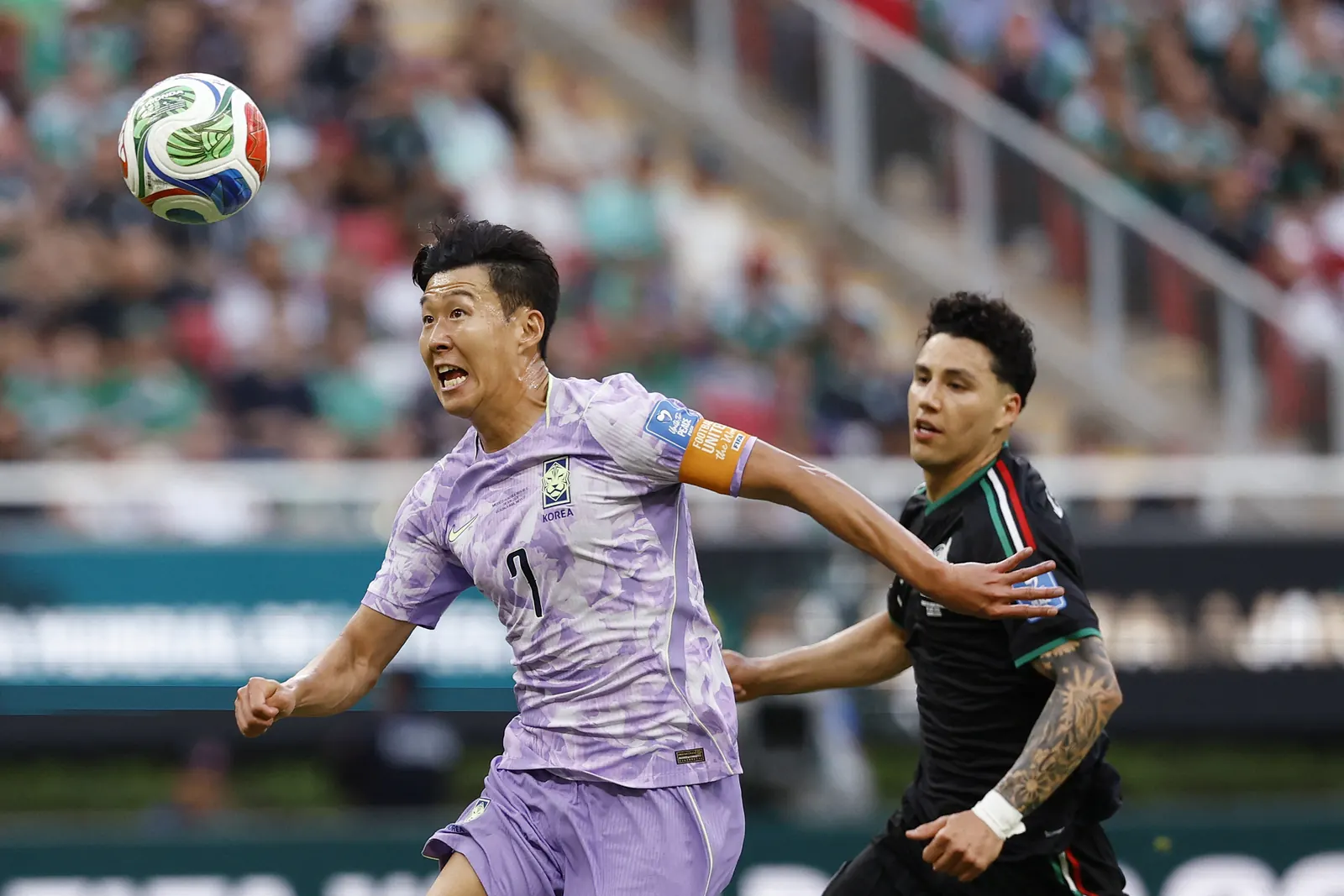 A jubilant Mexico player celebrates after scoring a goal against the Korea Republic during the FIFA World Cup 2026 match.