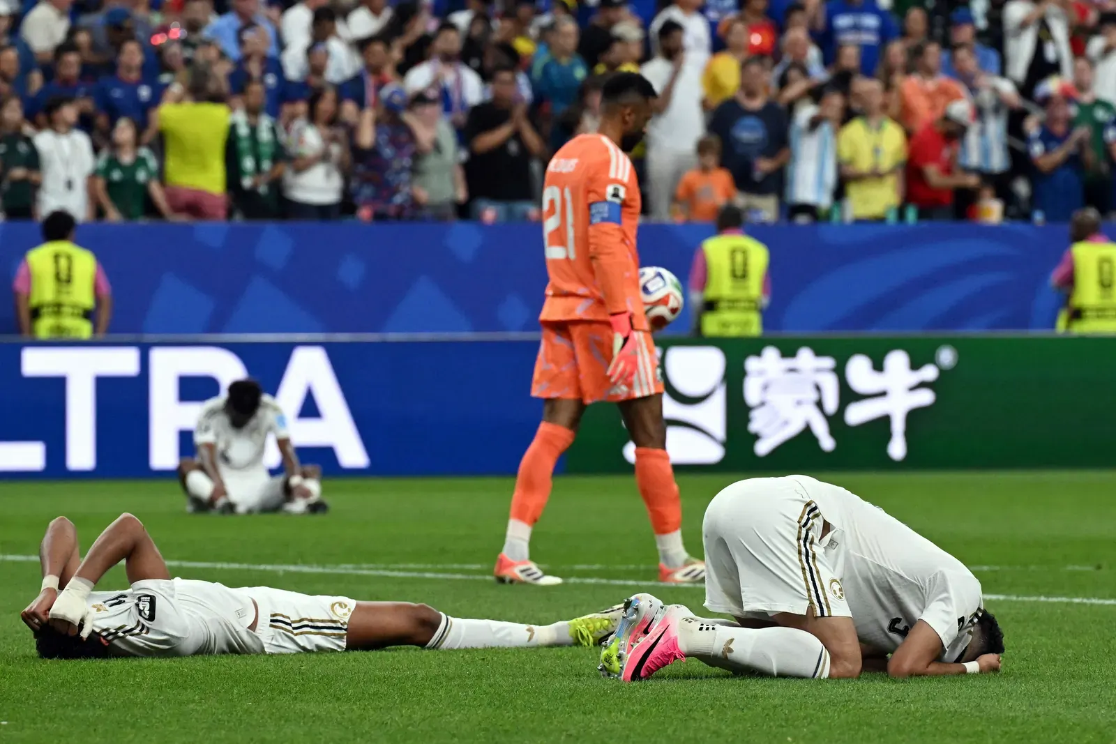 Saudi Arabia national football team players in action during a match.