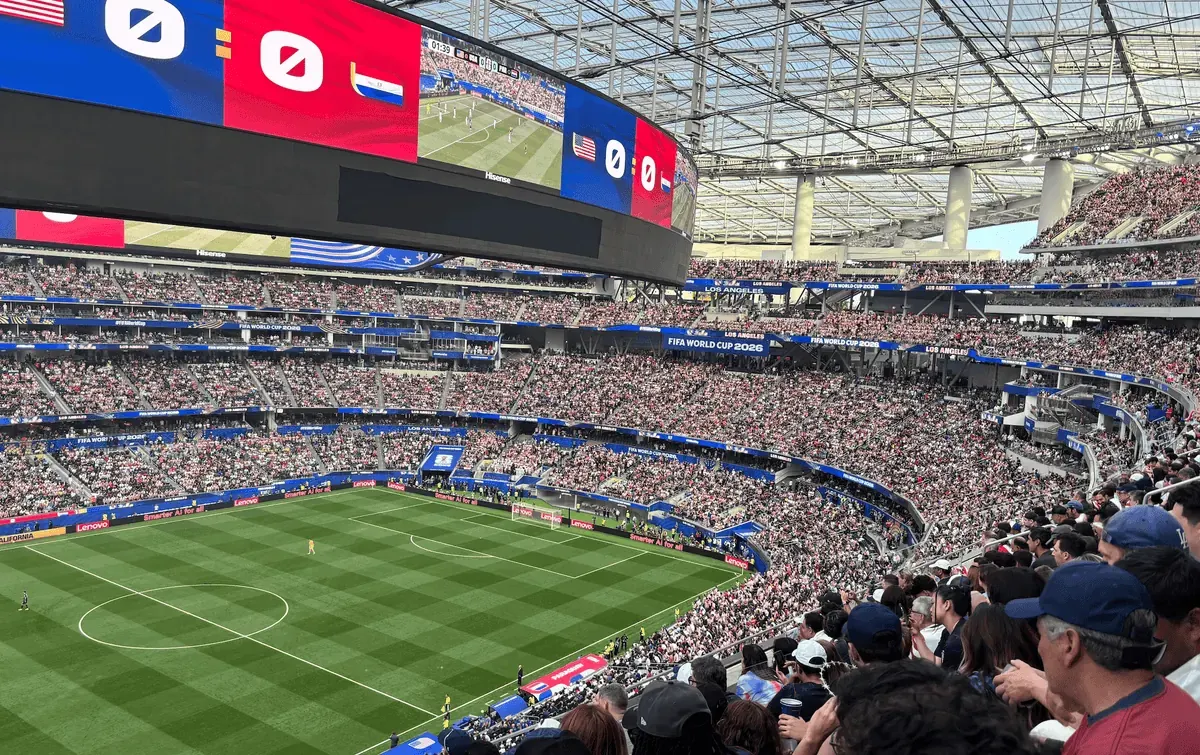 Exterior view of SoFi Stadium filled with fans for a football match