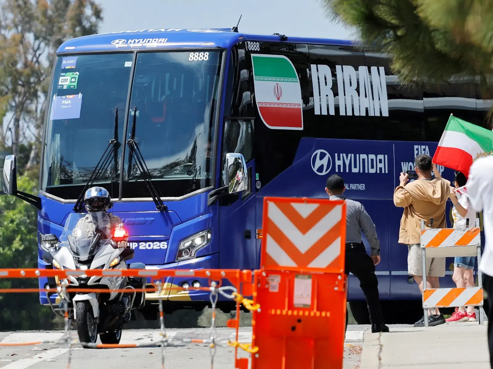 Iran national football team bus arriving at a hotel in Los Angeles under heavy security