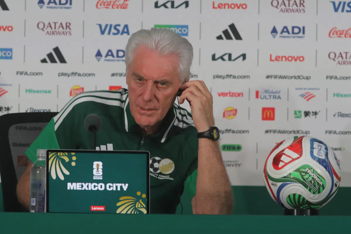 Hugo Broos, the coach of the South Africa national football team, looking thoughtful on the sidelines.