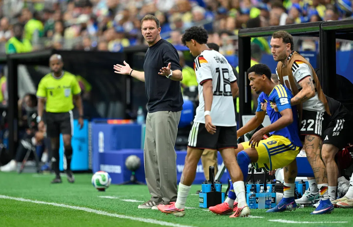 Germany national football team players celebrate a goal during a match.