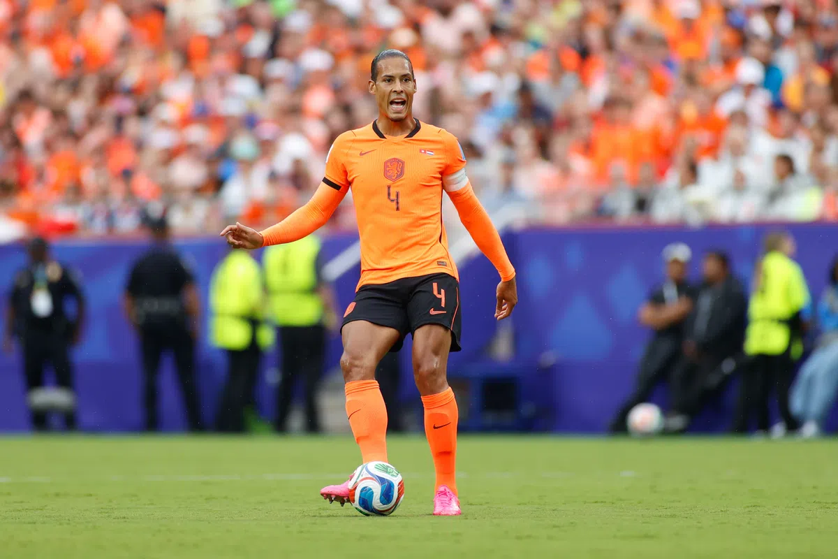 Virgil van Dijk in conversation with a teammate during a Netherlands training session.