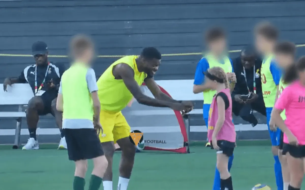 Thomas Partey interacting with young soccer players at Bryant University.