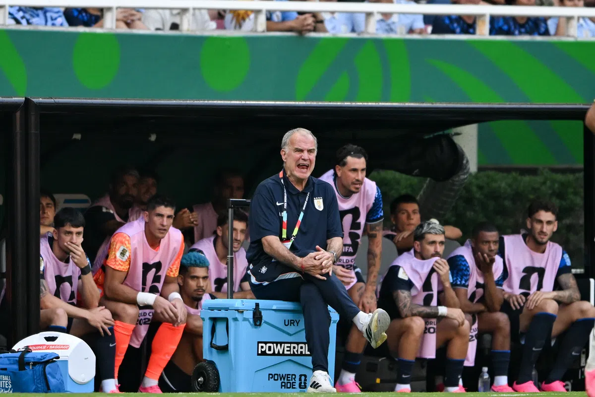 Marcelo Bielsa, manager of the Uruguay national football team, looking contemplative on the sidelines.