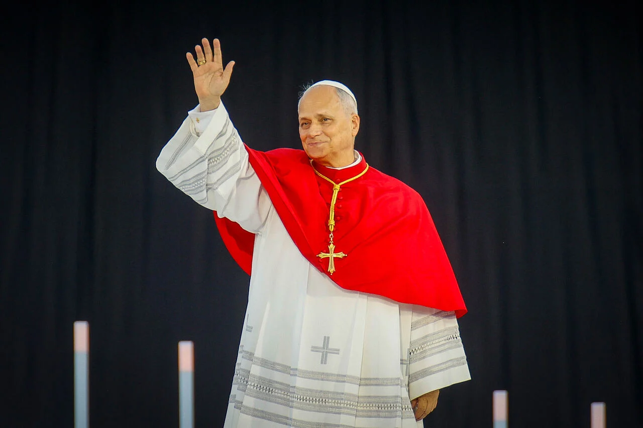Pope Leo XIV arriving in the Canary Islands, greeted by officials.