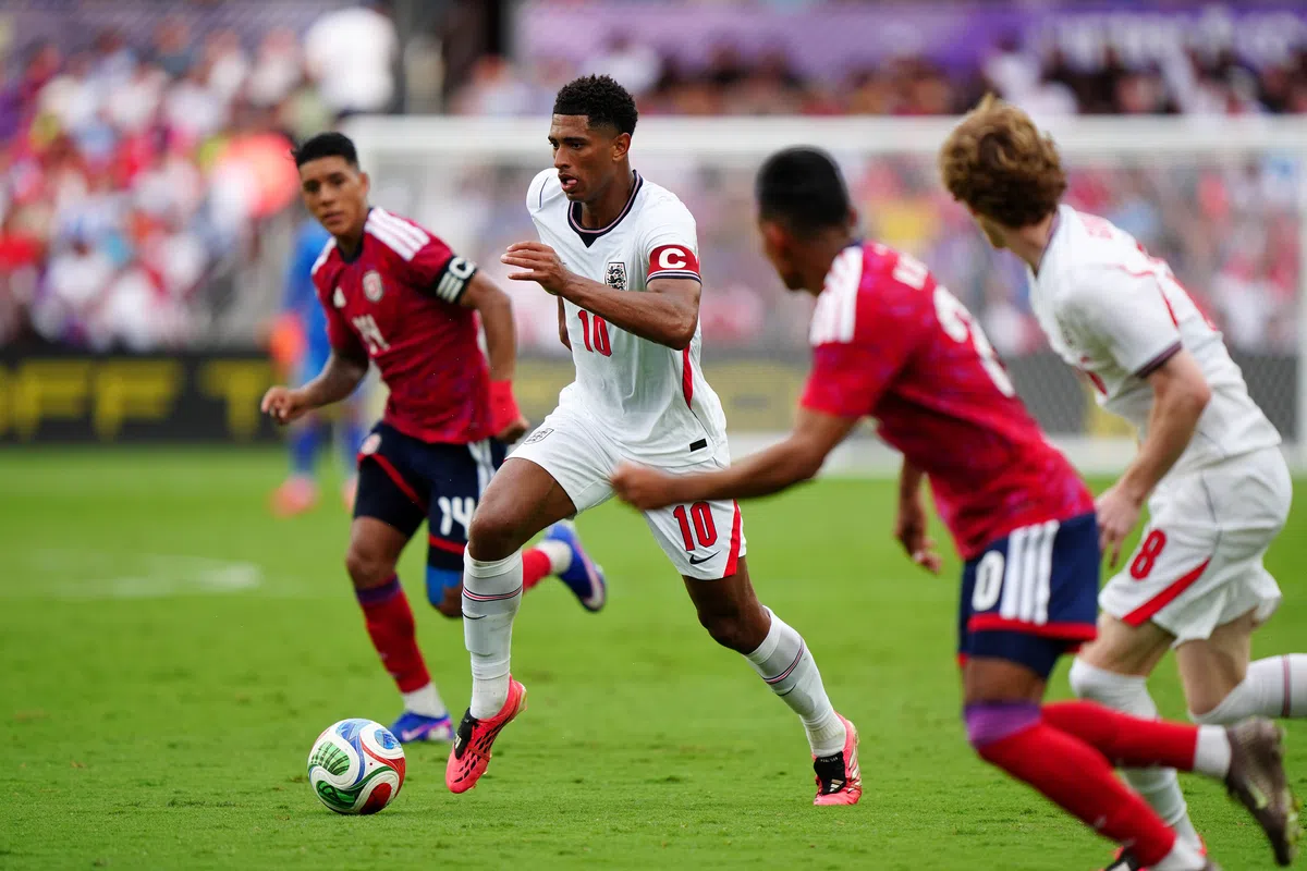 Jude Bellingham in action during England's pre-Euro friendly match, looking focused on the ball.