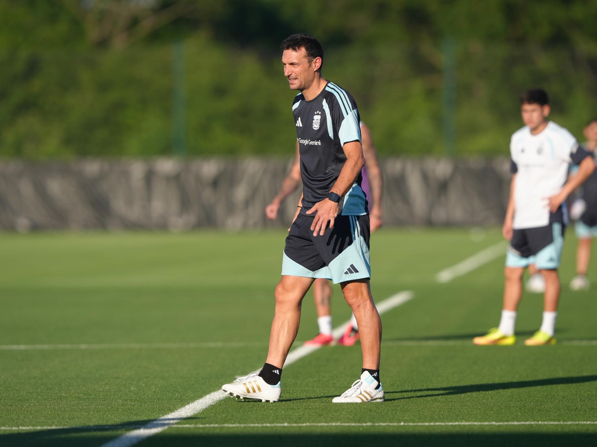 Argentina national football team players training on a field.