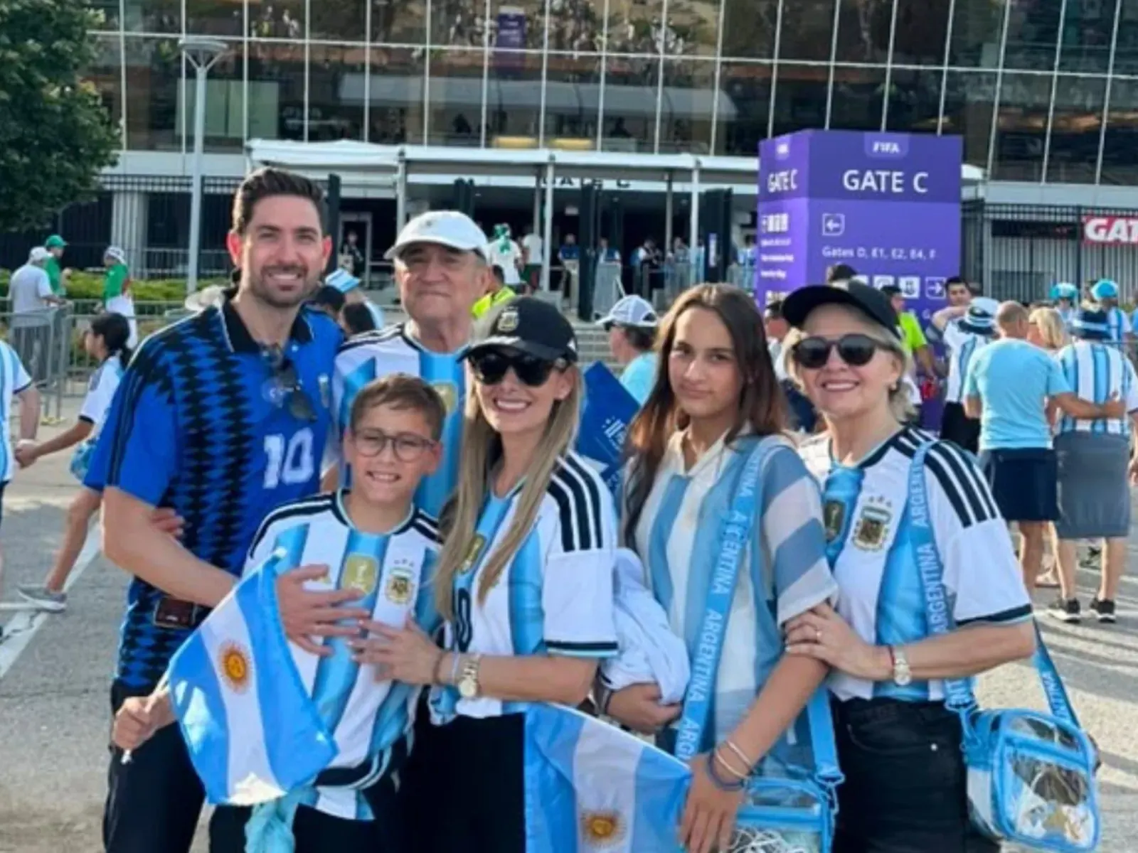 A vibrant crowd of football fans, many waving Argentinian flags, fills a stadium during a World Cup 2026 match.