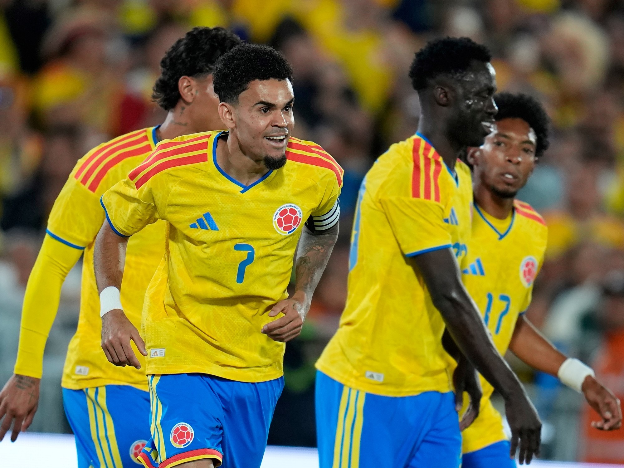 Players of the Colombian national football team celebrating a goal during their match against Costa Rica.