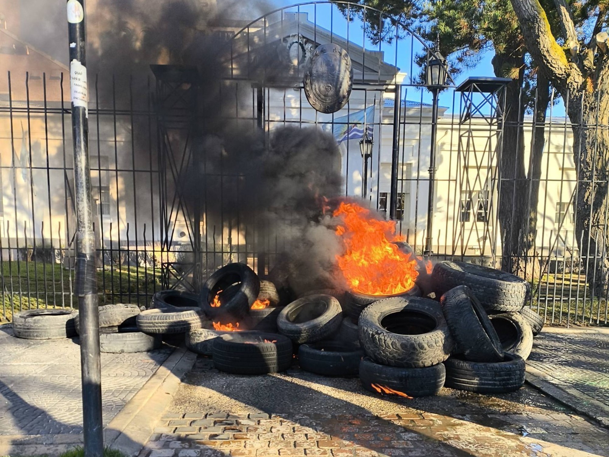 Teachers of Santa Cruz, Argentina, burning tires in front of the provincial government building during a protest.