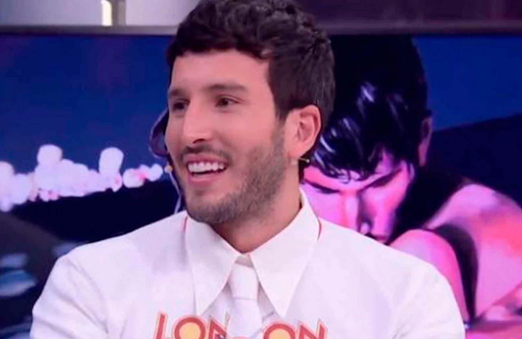 Colombian singer Sebastián Yatra performing live on a concert stage.