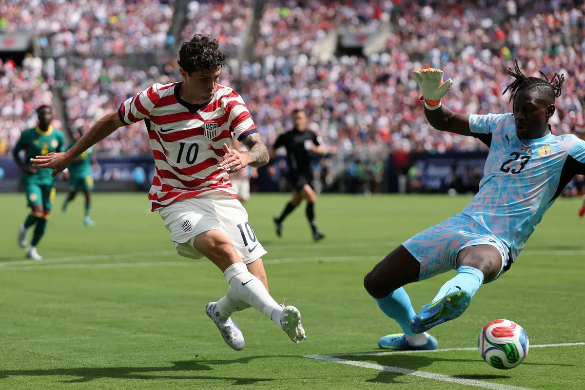 Christian Pulisic of the United States celebrates scoring a goal during an international friendly match.