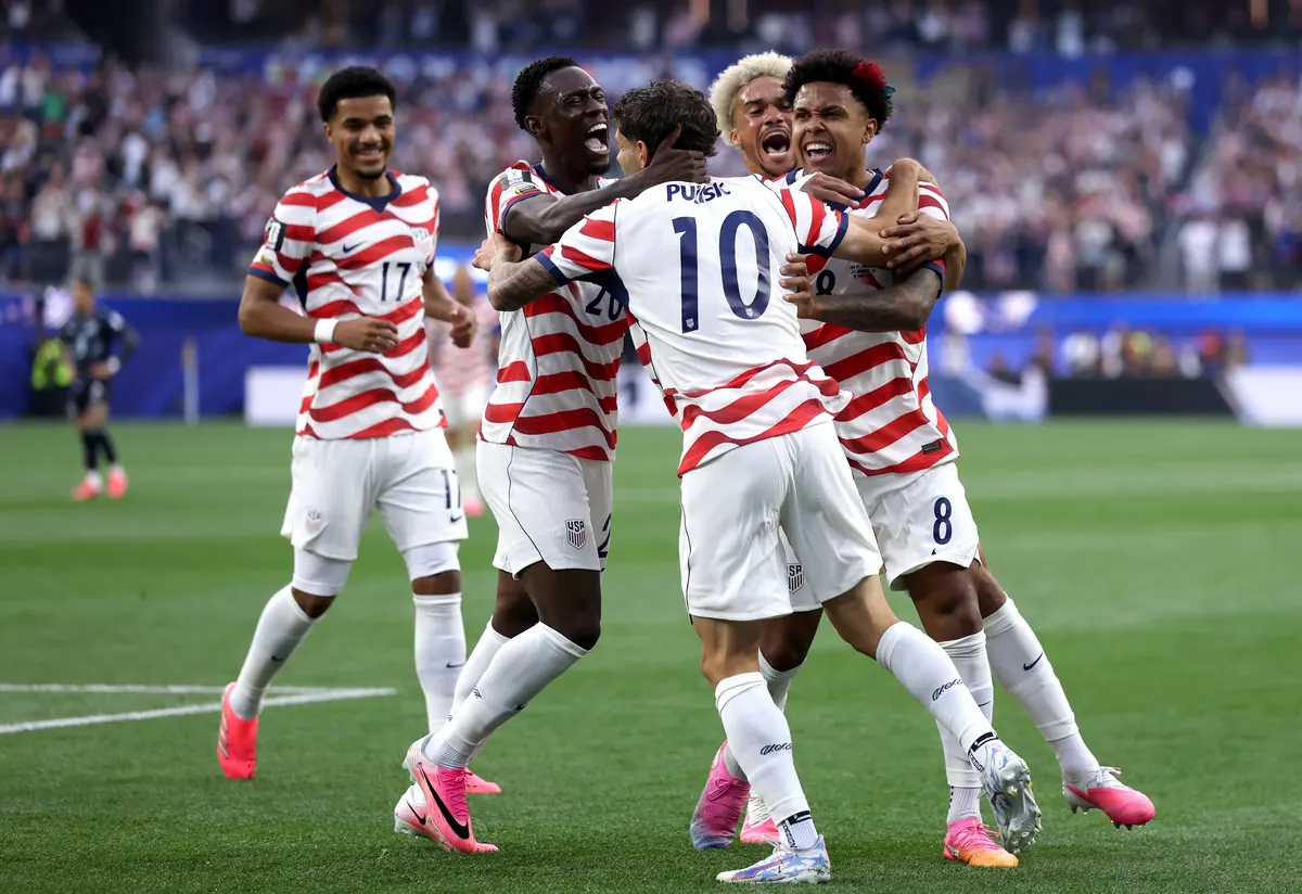 Christian Pulisic and Weston McKennie of the United States celebrate a goal during their 2026 World Cup match against Paraguay.