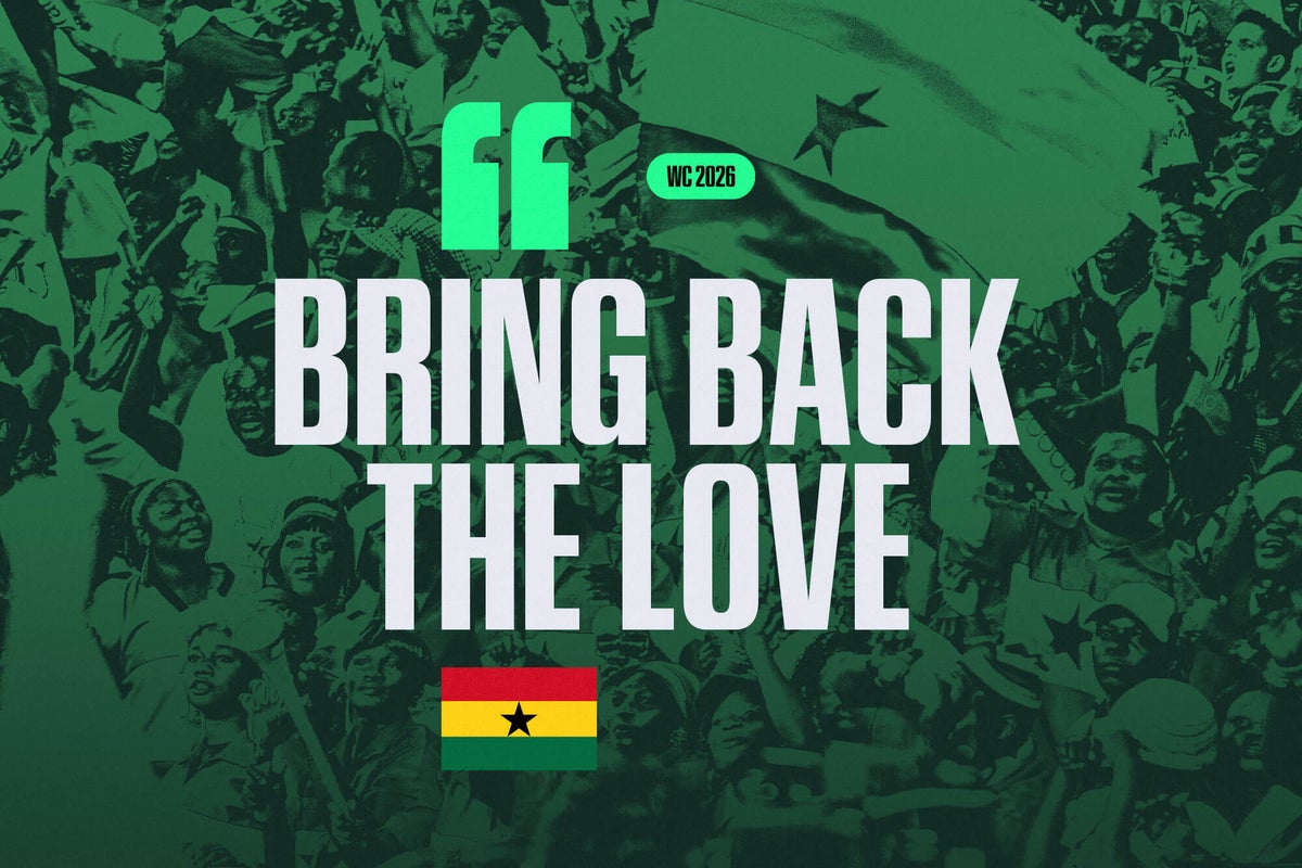 Diverse group of Ghanaian football fans in vibrant national colours cheering enthusiastically at a stadium.