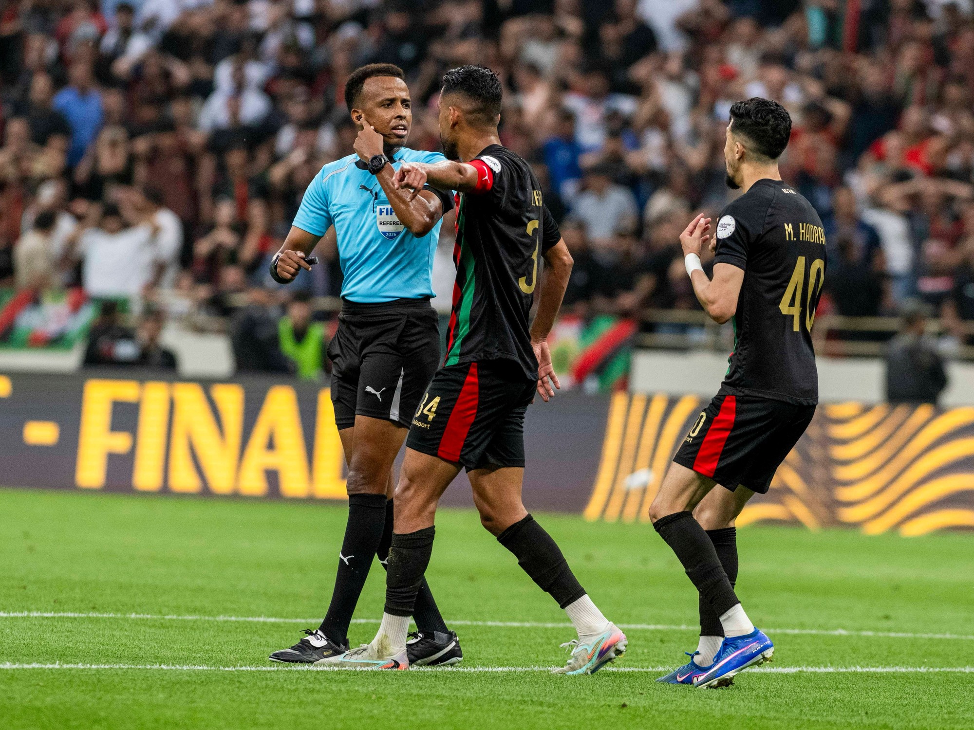 Somali referee Omar Artan officiating an African Champions League match.