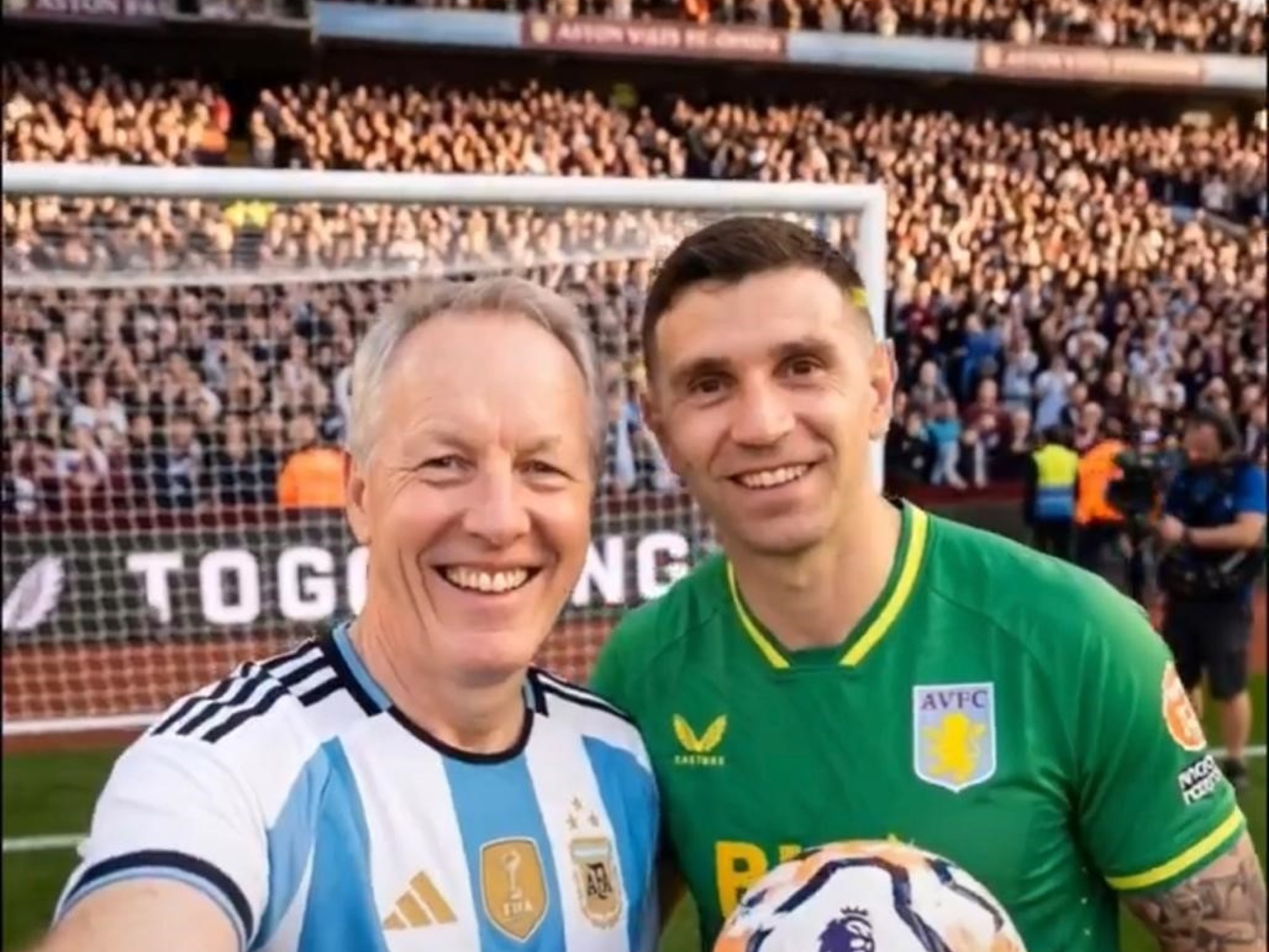 British Ambassador David Cairns in an Argentina football jersey, posing virtually with Argentine players in front of English landmarks.