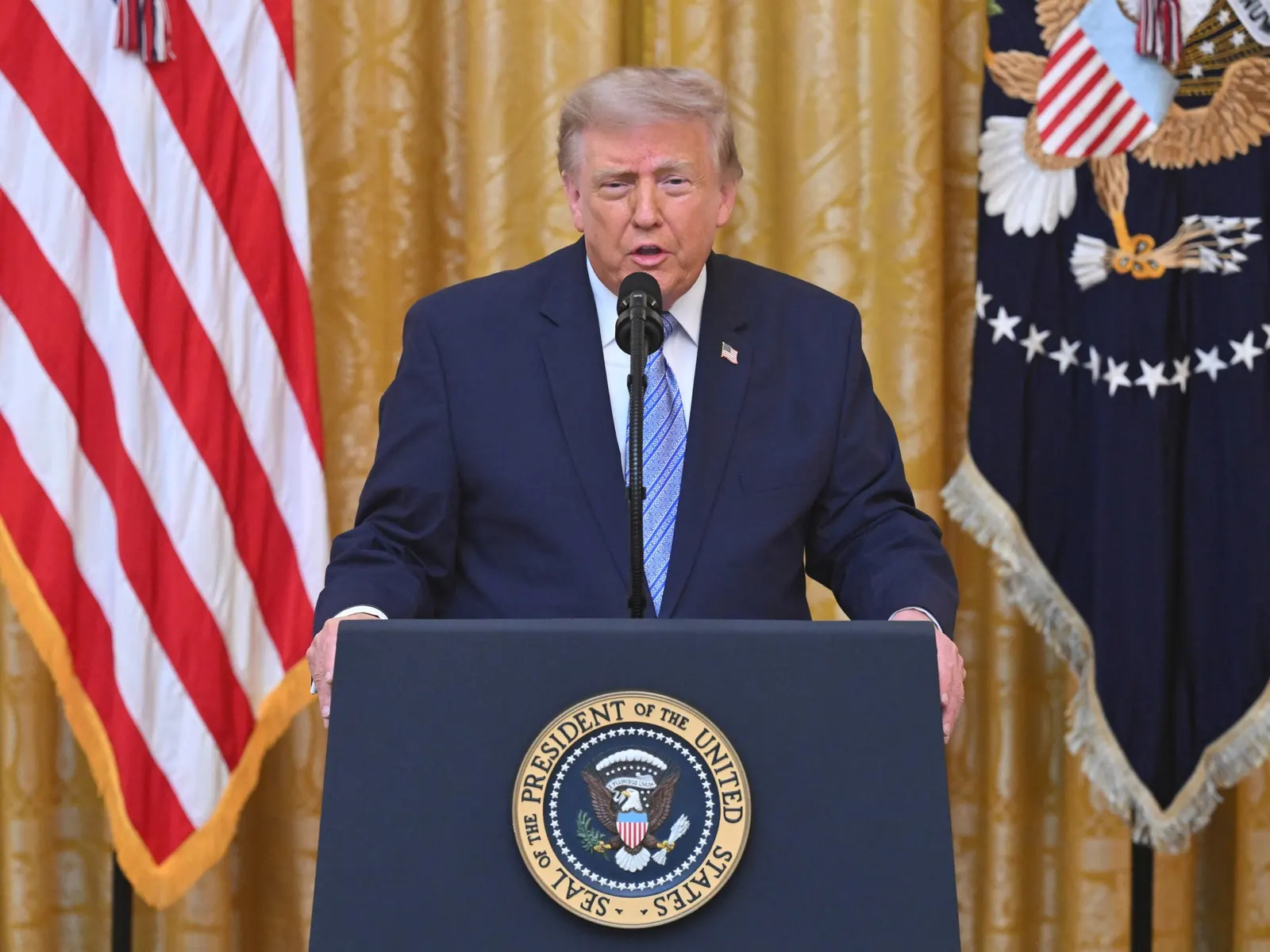 U.S. President Donald Trump addresses reporters in the White House.