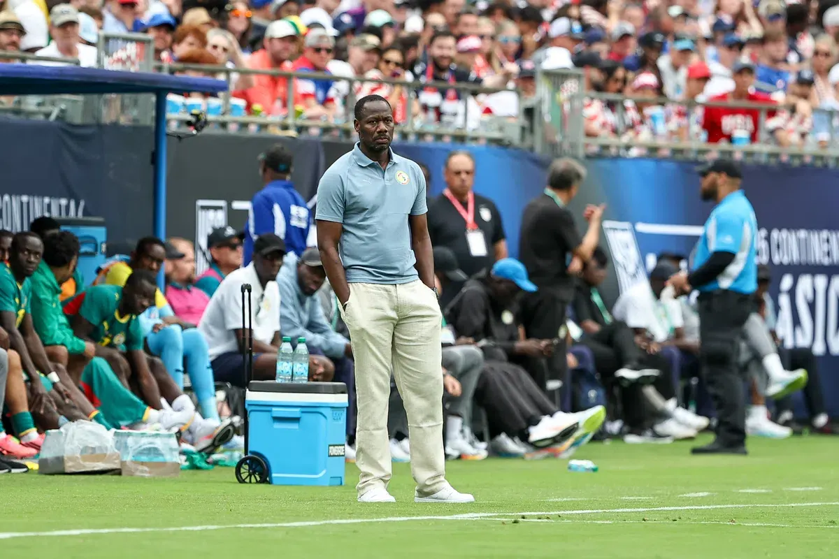 Senegal national football team players celebrating a goal on the field.