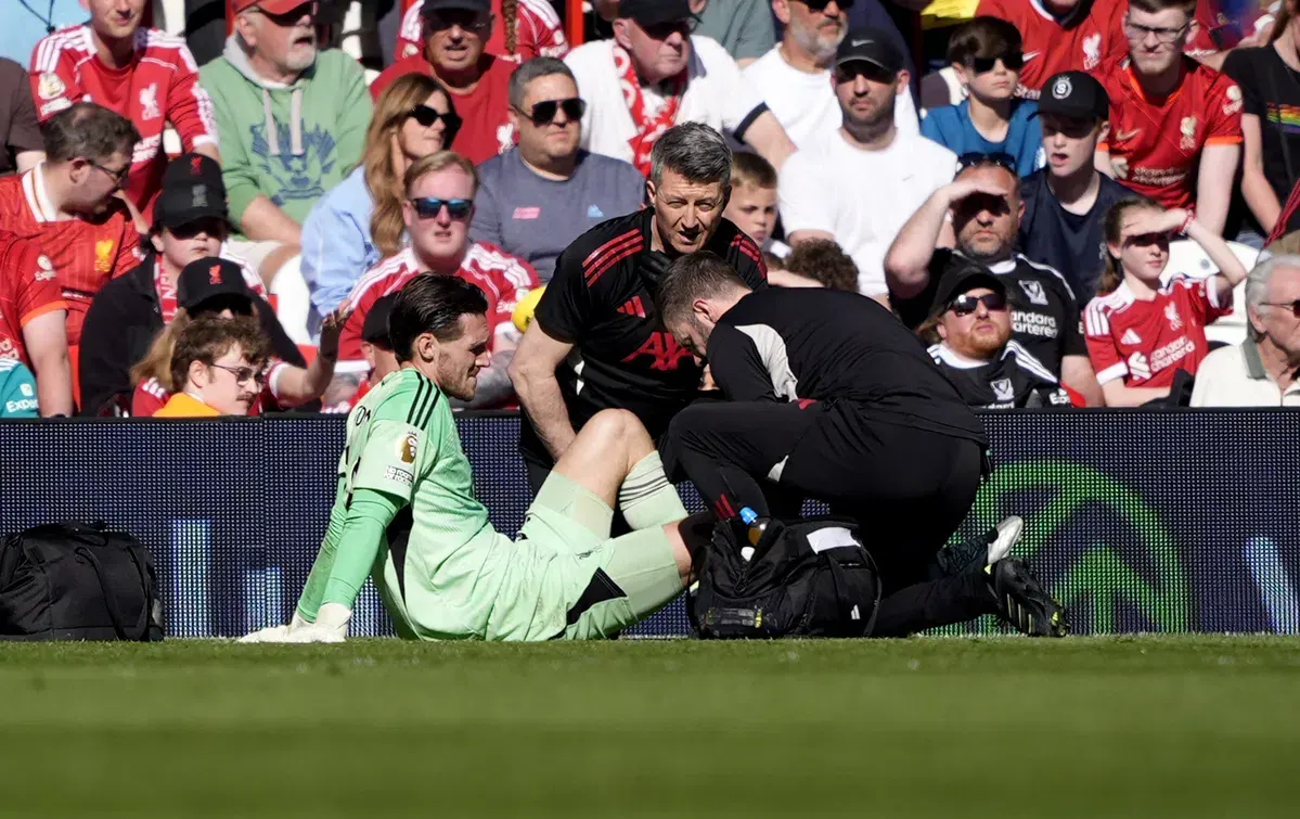 Goalkeeper receiving medical treatment on the pitch during a football match