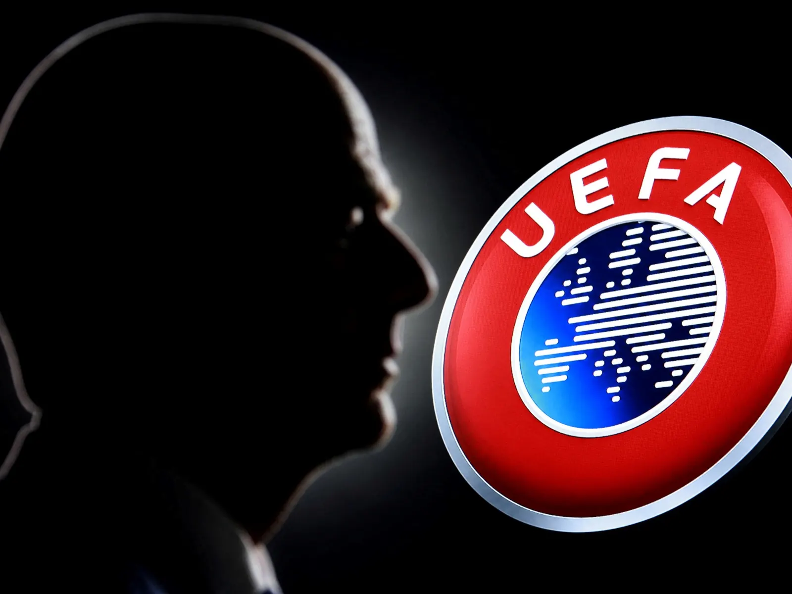 FIFA President Gianni Infantino and UEFA President Aleksander Ceferin stand in a meeting room, representing the ongoing conflict between the two football governing bodies.