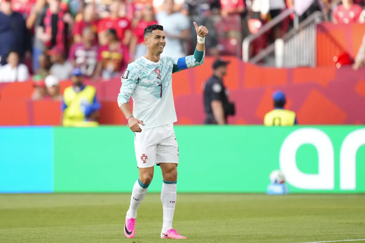 Cristiano Ronaldo celebrating a goal for Portugal during a World Cup match.