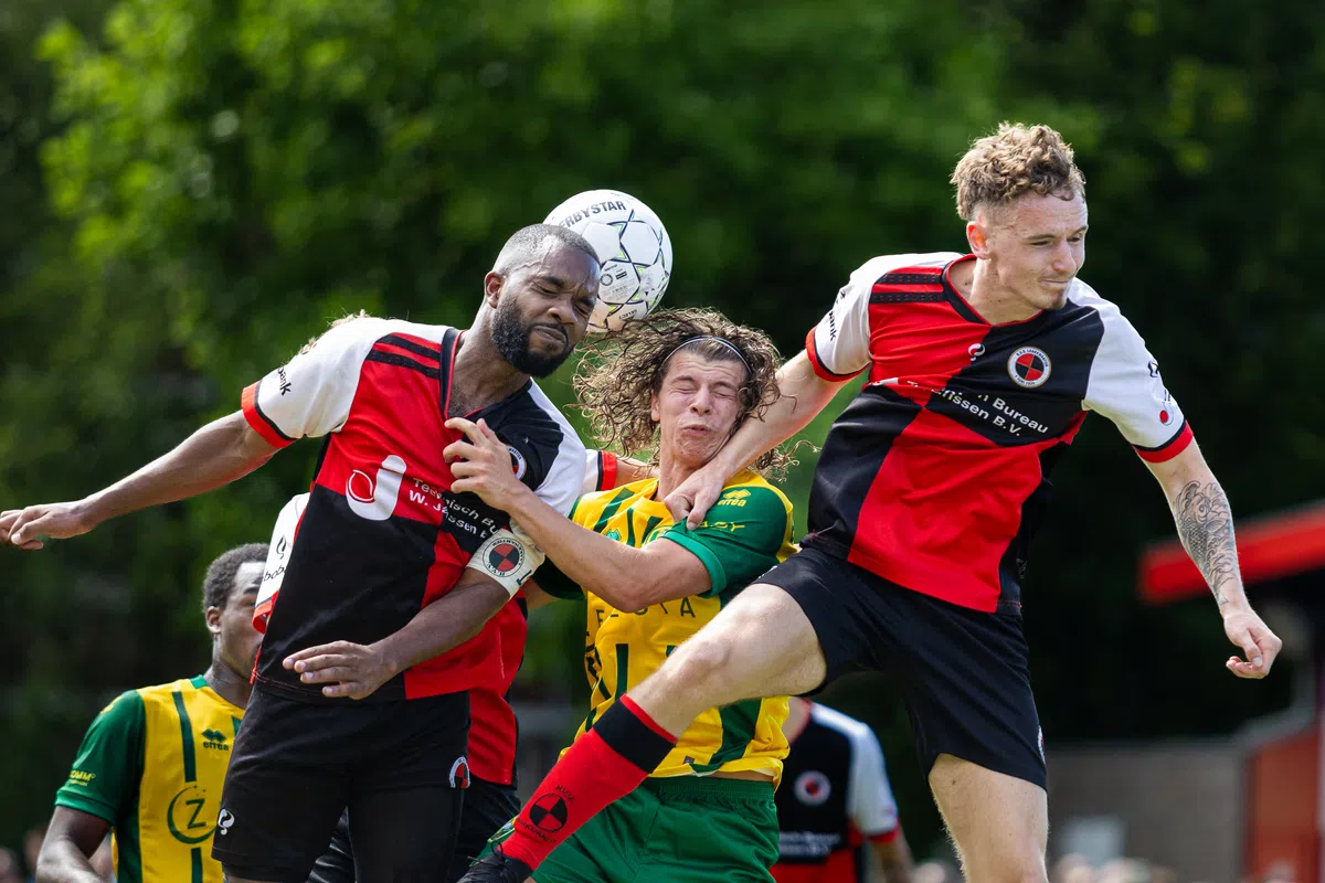 Fans gather at a community football pitch for the pre-season friendly between ADO Den Haag and Laakkwartier.