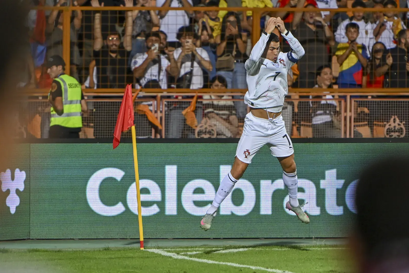 Cristiano Ronaldo celebrating a goal while playing for the Portugal national football team.