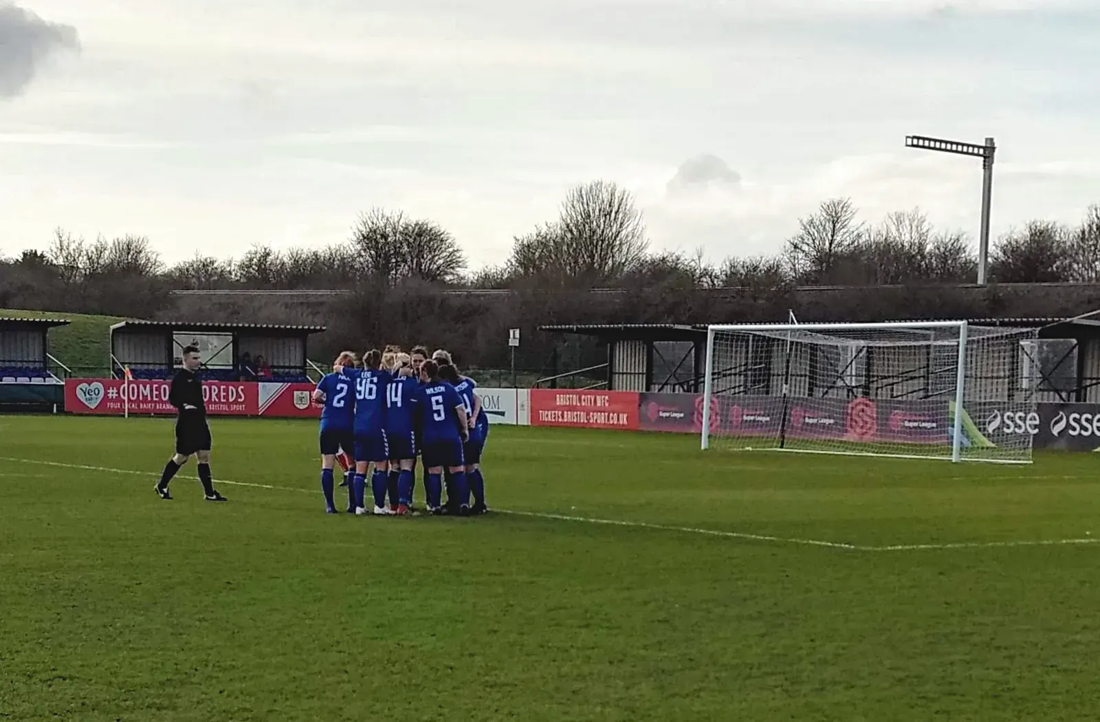 England players celebrate a goal during a match.