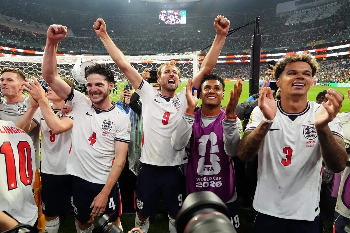 England players celebrate a goal during their World Cup match against Mexico at the Azteca Stadium.