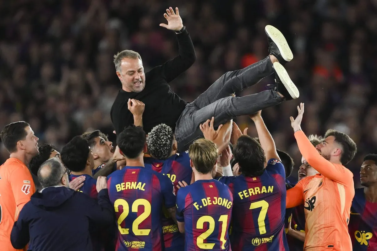 FC Barcelona manager Hansi Flick celebrating a La Liga title victory.