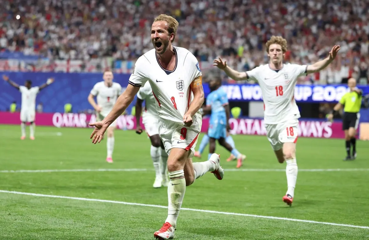 Harry Kane in Bayern Munich kit celebrating a goal, with fans in the background