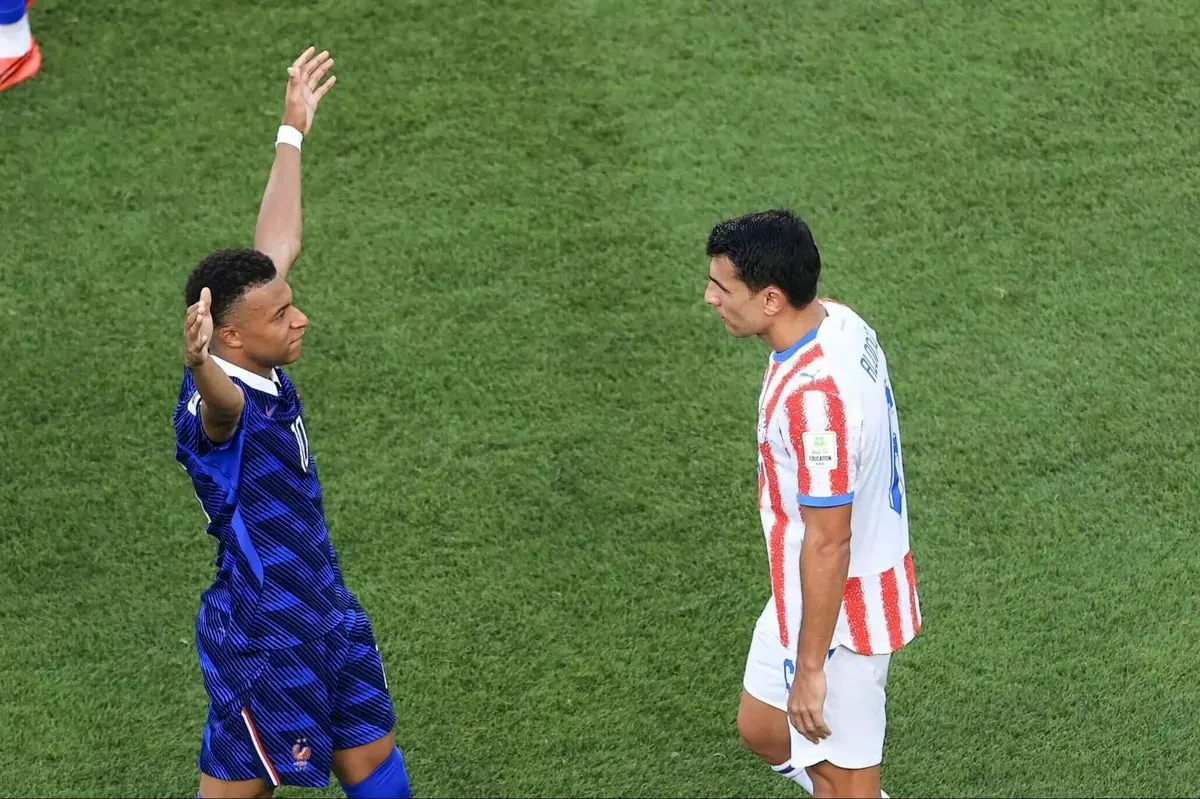 Kylian Mbappe celebrates after scoring a penalty against Paraguay in the FIFA World Cup.