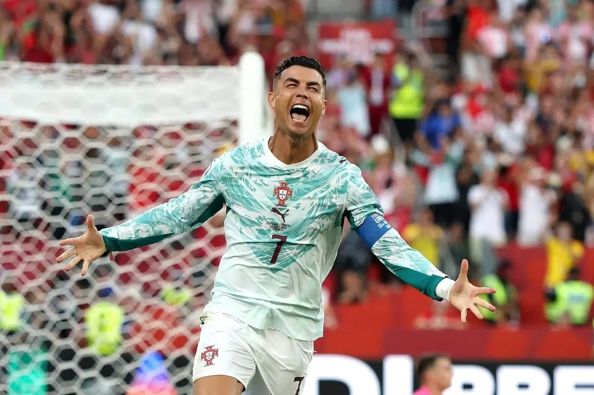 Cristiano Ronaldo celebrating scoring a goal during a World Cup match.