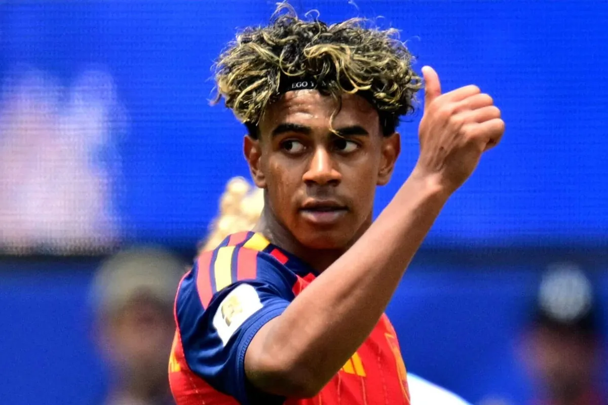Lamine Yamal celebrating a goal for Spain during a match.