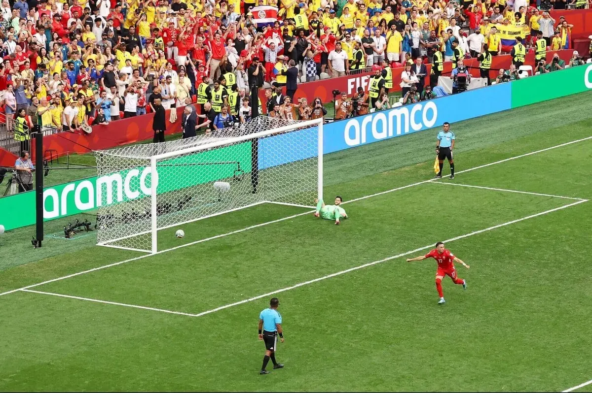 Switzerland goalkeeper Gregor Kobel makes a crucial save during the penalty shootout against Colombia in the FIFA World Cup 2026 round of 16 match.