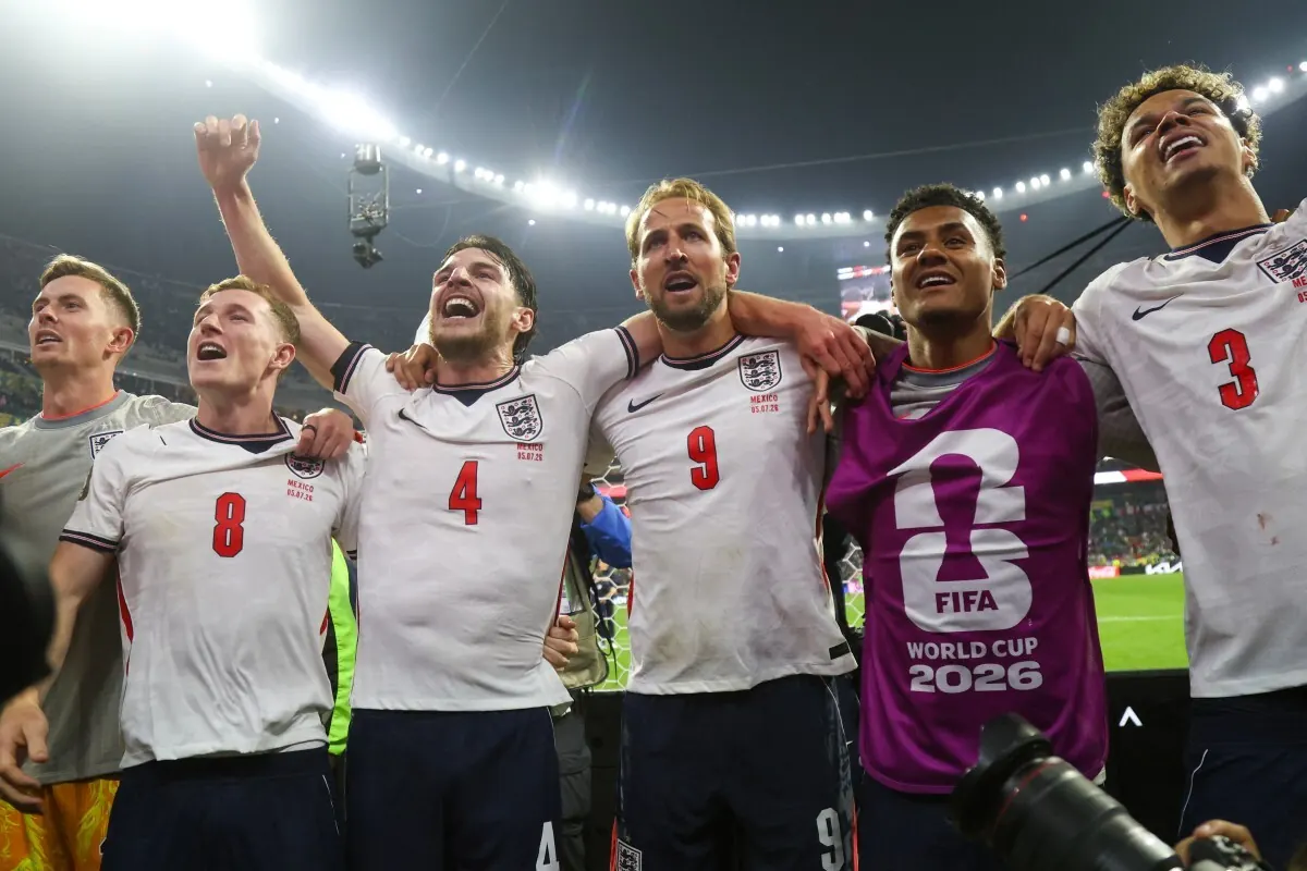 England players celebrate a goal during their World Cup match against Mexico