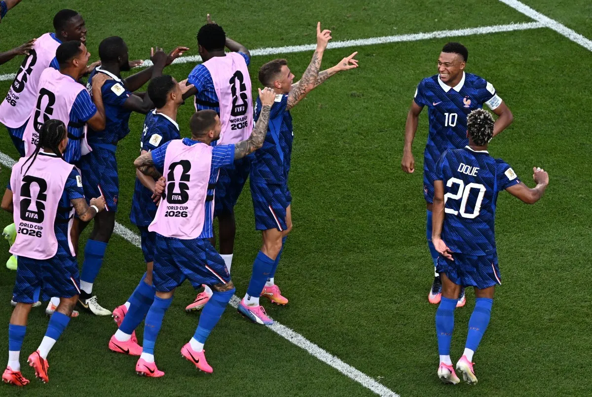 France's national football team celebrating a moment of victory during a FIFA World Cup 2026 match.
