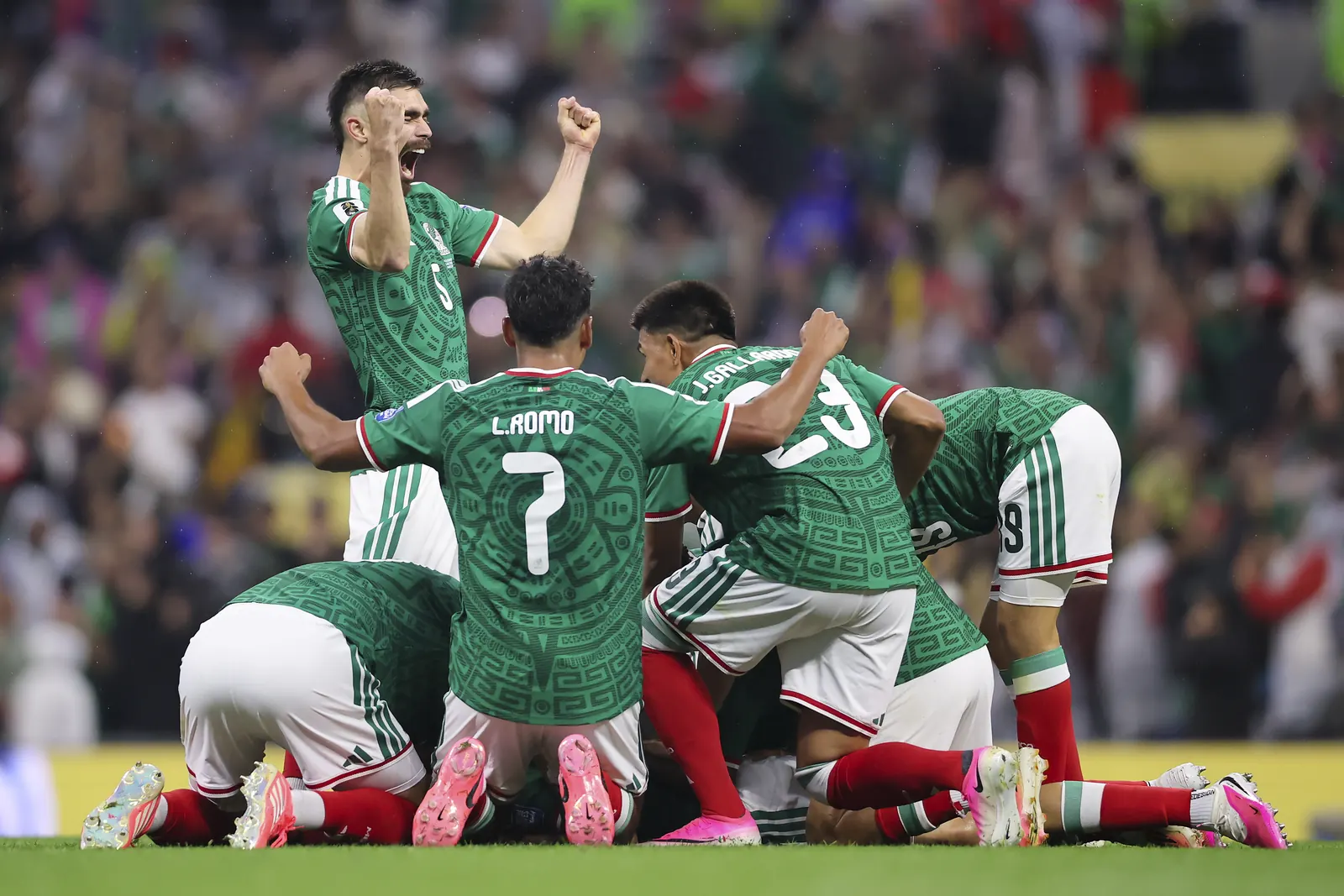 Mexico football players celebrating a goal during their match against Ecuador at the FIFA World Cup 2026.