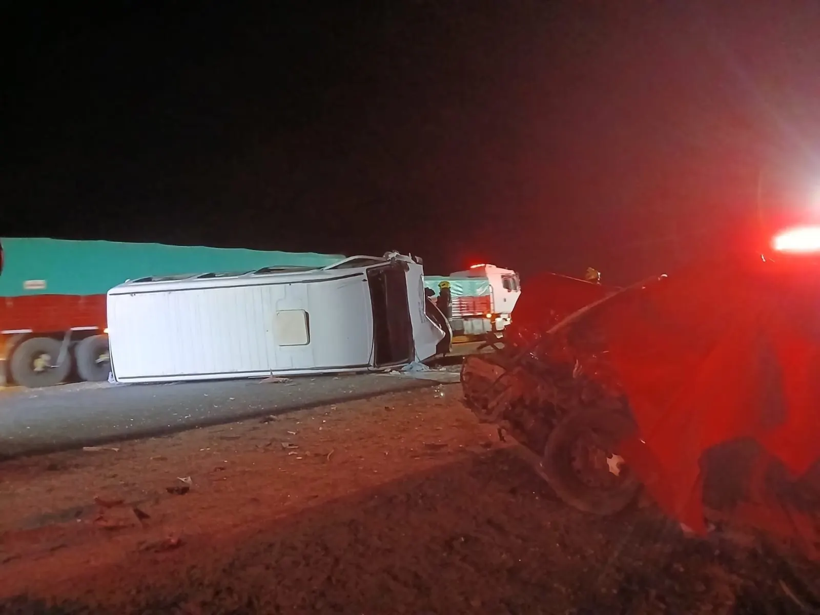 Damaged vehicles at the scene of a bus crash on a road in Córdoba, Argentina.