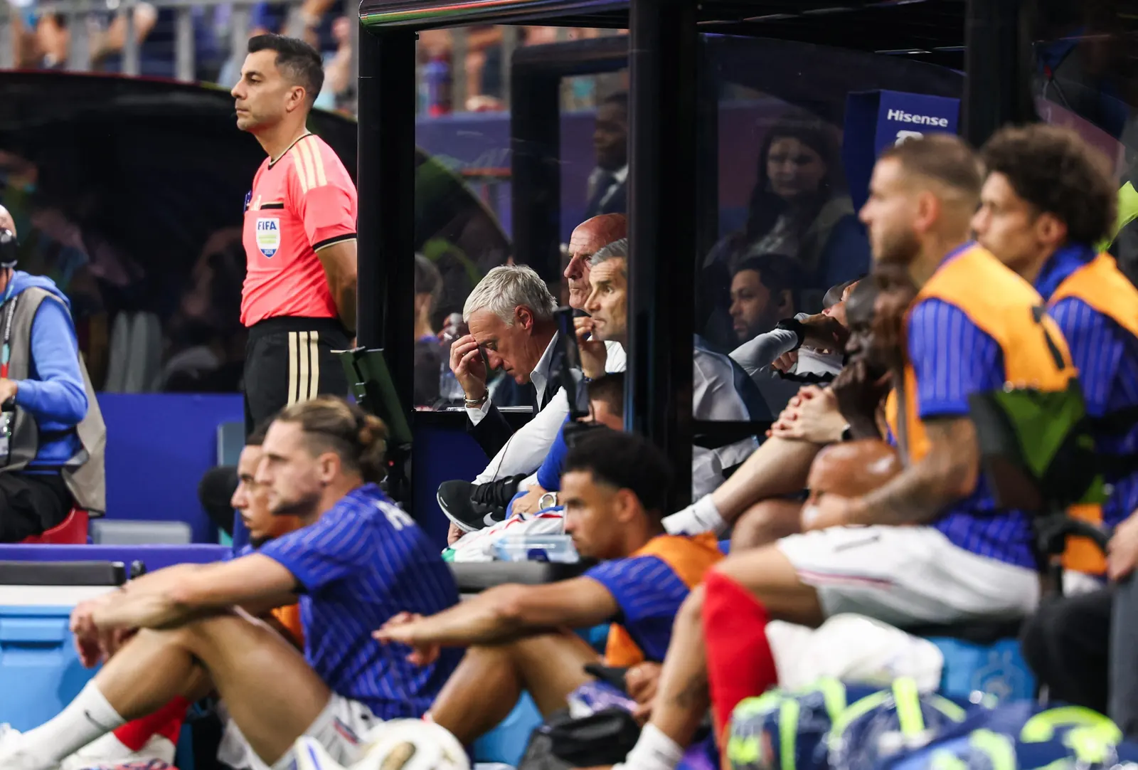 France players look dejected after a football match.