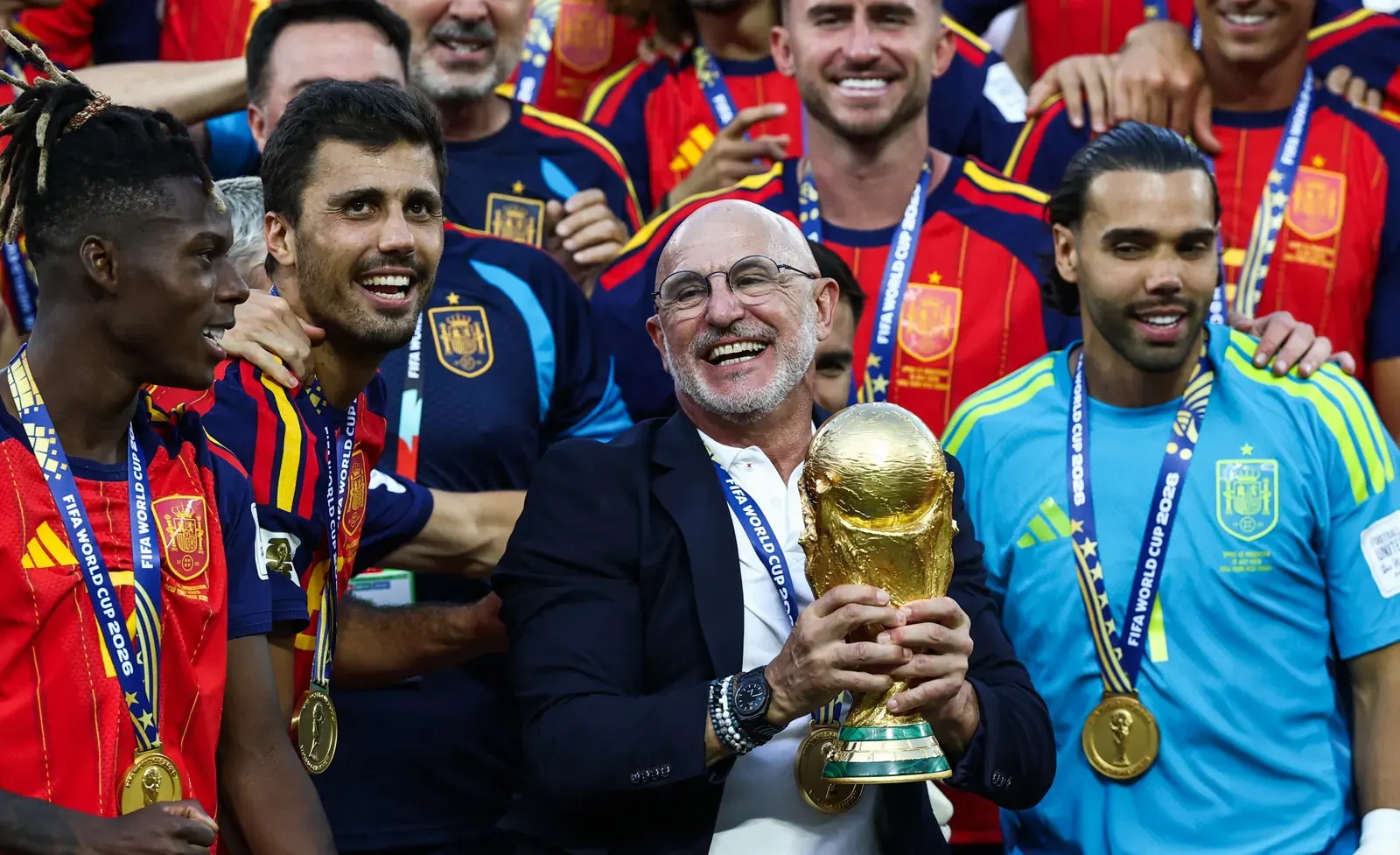 Spain national football team players celebrating with the FIFA World Cup 2026 trophy
