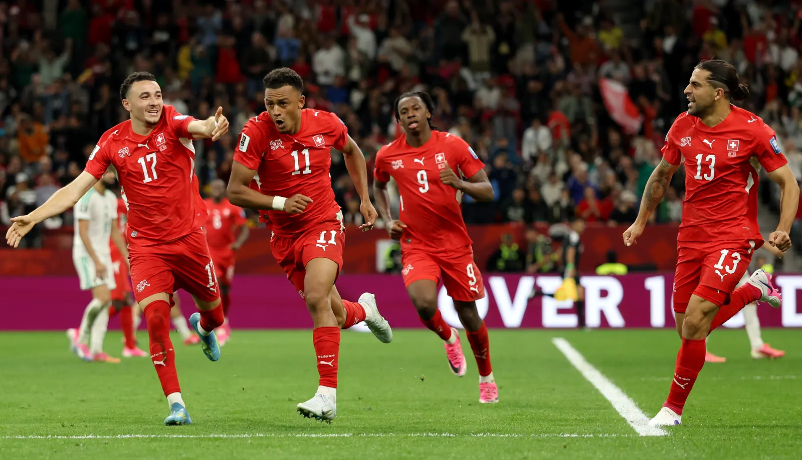 Switzerland players celebrate a goal during their FIFA World Cup 2026 match against Algeria.