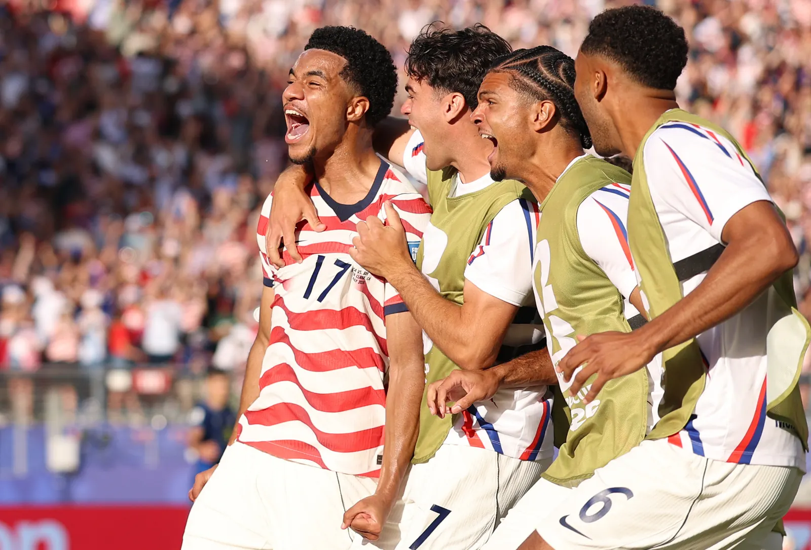 USA players celebrating a goal during the FIFA World Cup 2026 match against Bosnia-Herzegovina.