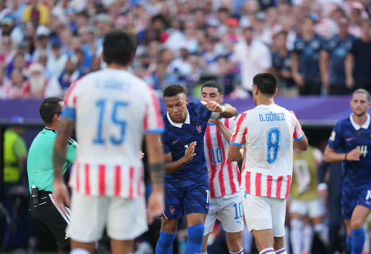 Kylian Mbappé of France celebrates after scoring a penalty kick during the World Cup 2022 quarter-final match against Paraguay.