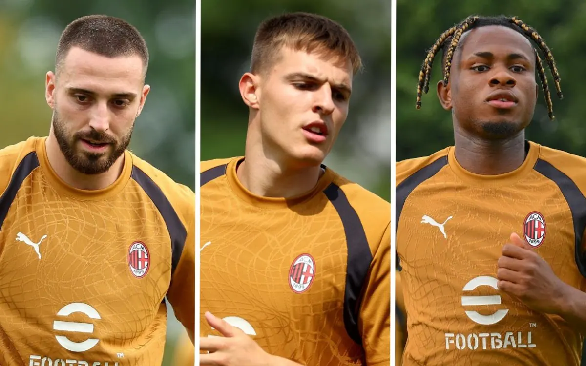 AC Milan players participate in a training match during preseason.