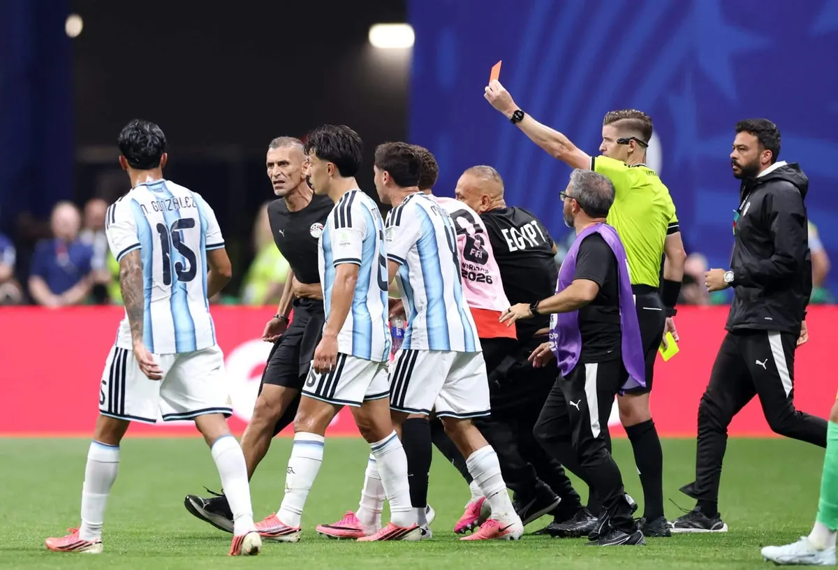 Argentina football players celebrating a goal during a World Cup match.